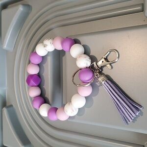 Great Gift!- Silicone wristlet in shades of purple with lobster claw & Ring